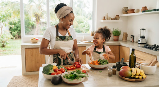 A caregiver preparing food with a child
